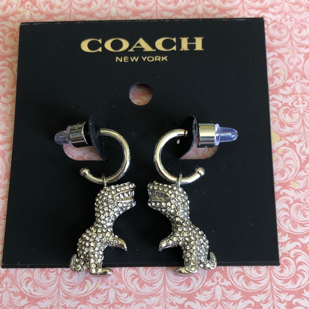 Authentic silver tone New on card Coach crystal Dinosaur Earrings.